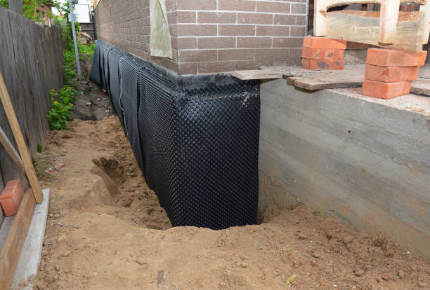 SJ Waterproofing Pros technician performing targeted Basement Waterproofing assessment in Burlington, OH